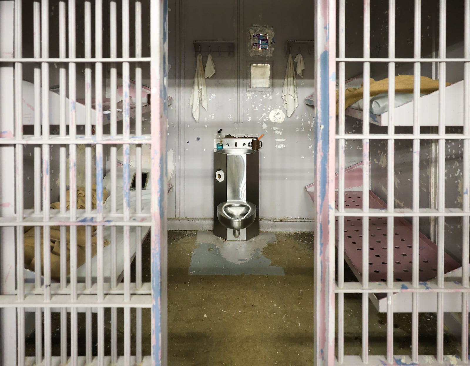 A view of cells in in the Miami County Jail, the county's maximum security facility in the safety building in downtown Troy. Each cell can fit up to four inmates. The cell pictured is used for housing female inmates. "No one has bars anymore," assistant jail administrator Nate Collett said. BRYANT BILLING / STAFF