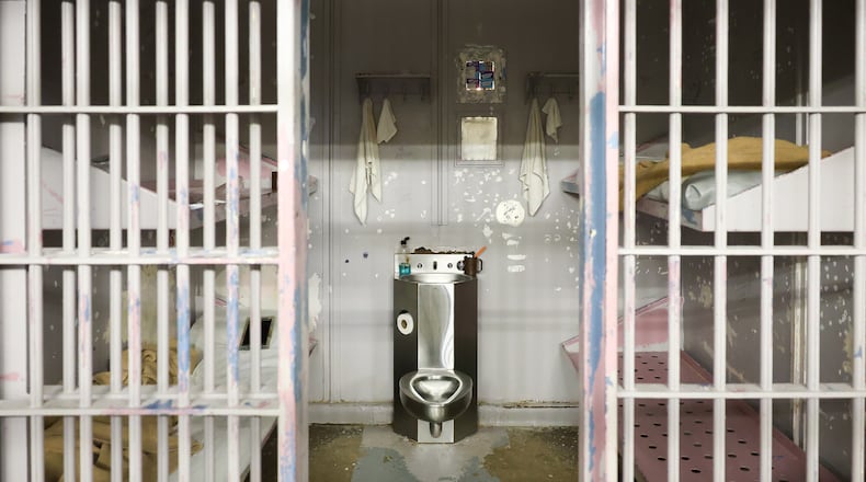 A view of cells in in the Miami County Jail, the county's maximum security facility in the safety building in downtown Troy. Each cell can fit up to four inmates. The cell pictured is used for housing female inmates. "No one has bars anymore," assistant jail administrator Nate Collett said. BRYANT BILLING / STAFF