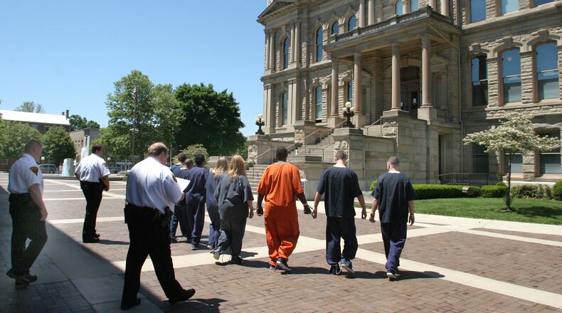 Miami County Sheriff Dave Duchak wants to place security checkpoints at the Miami County Courthouse and Safety Building. In this file photo, bailiffs’ move prisoners from the Sheriffs jail to the old Miami County Courthouse on their way to Municipal Court in Troy.