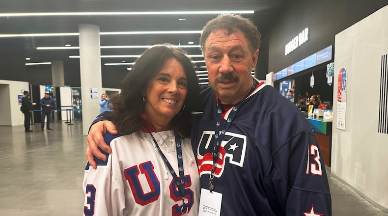 Jane and Guy Gaudreau, parents of the late Matthew and John Gaudreau, attend the men's ice hockey semifinal game against Slovakia, during the 2026 Winter Olympics, in Milan, Italy, Friday, Feb. 20, 2026. (AP Photo/Stephen Whyno)