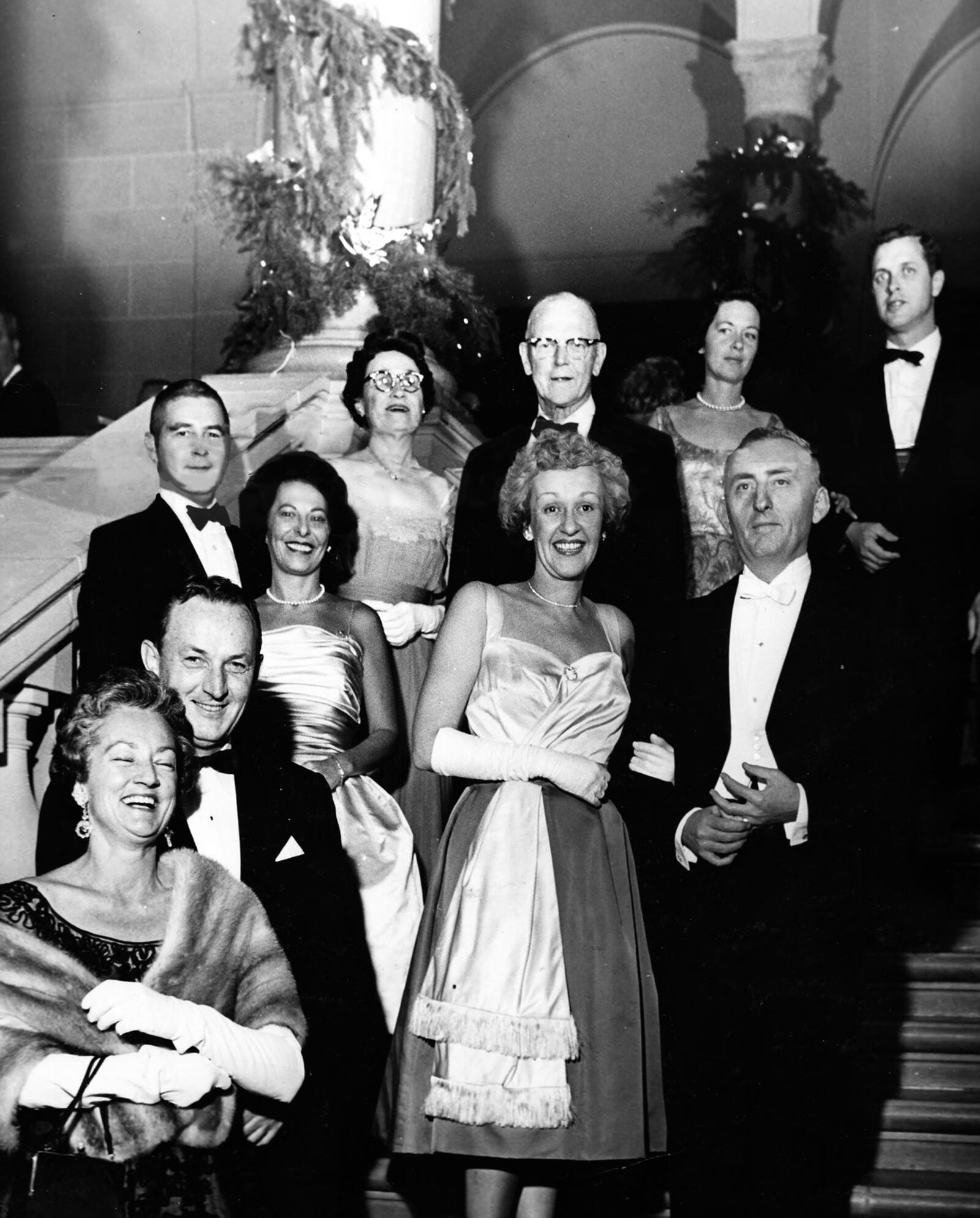 A caption for this 1960 photograph reads: Mr. and Mrs. Thomas Wasmuth, second row, left to right, Mr. and Mrs. Boris Sokol, Mr. and Mrs. John Sullivan Jr., third row, left to right, Mr. and Mrs. Francis Dean Schnacke, Mr. and Mrs. John J. Cote at the 1960 Art Ball. DAYTON DAILY NEWS ARCHIVE