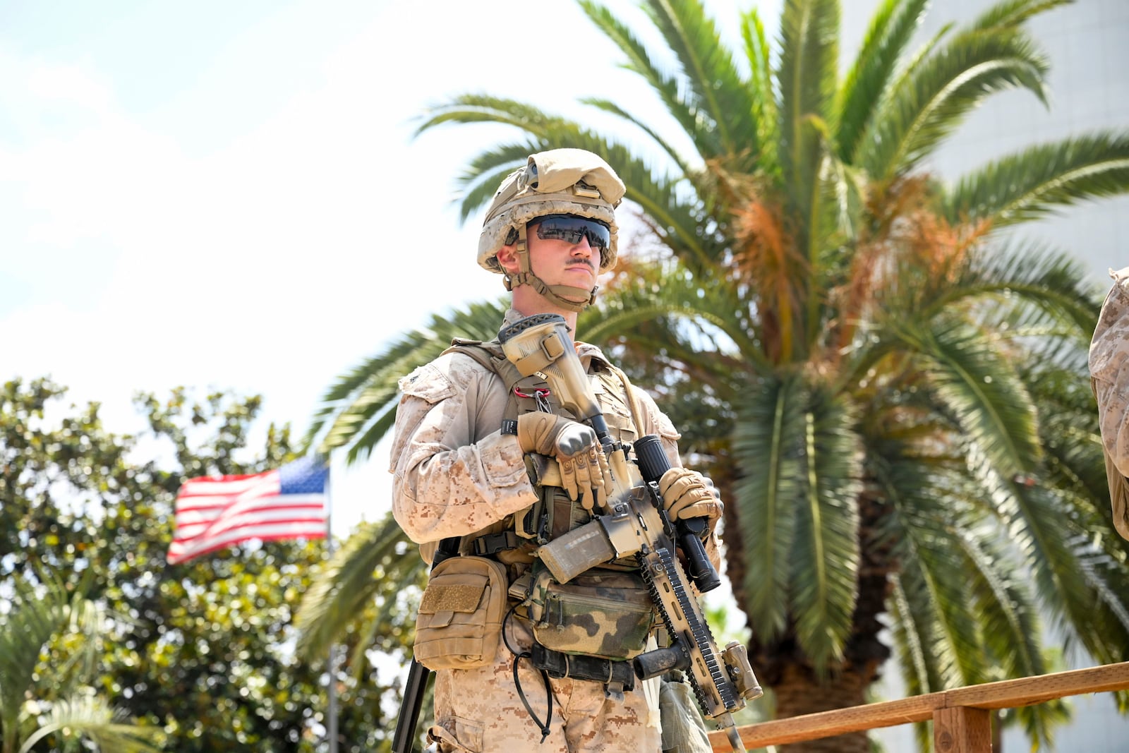 A U.S Marine guards a federal building, Friday, June 13, 2025, in Los Angeles (AP Photo/Noah Berger)
