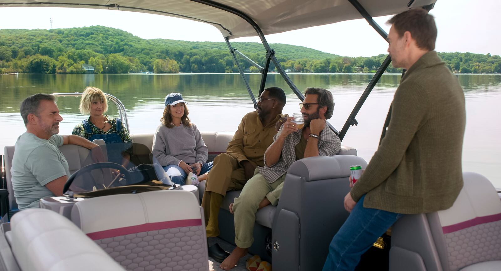 This image released by Netflix shows Steve Carell, Kerri Kenney, Tina Fey, Colman Domingo, Marco Calvani, and Will Forte in a scene from "The Four Seasons". (Netflix via AP)