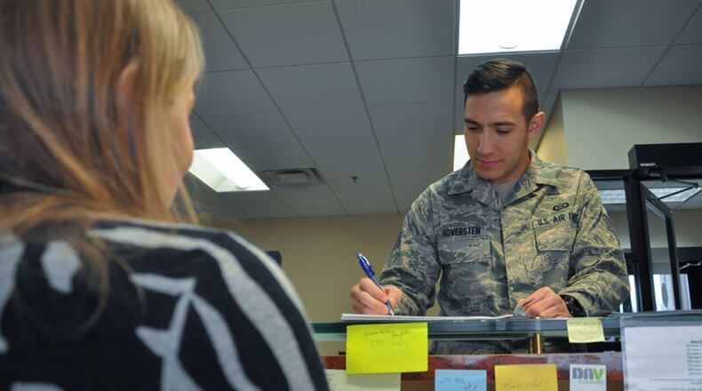 Amanda Harrell, Airman and Family Readiness Center volunteer, helps Staff Sgt. Greg Hoversten with various questions he has about the base and what classes the center is currently offering. The A&FRC Information Referral desk at Wright-Patterson Air Force Base is a one-stop shop for those who have a question but don’t know where to go. (U.S. Air Force photos/Staff Sgt. Ashley Clingerman)