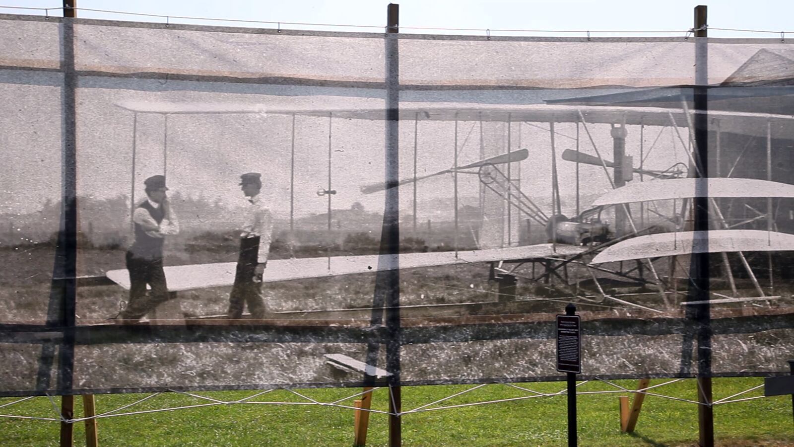 Dan Patterson, Artist in Residence with the Dayton Aviation Heritage National Historical Park had a 1904 image of the Wright Brothers on Huffman Prairie printed on mesh for display on the site of the original photo.  TY GREENLEES / STAFF