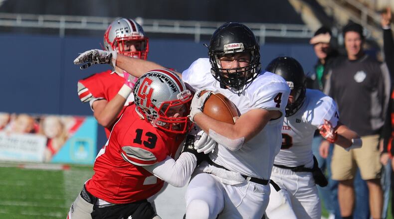 Minster’s Isaac Schmiesing is pushed out of bounds. Minster defeated Cuyahoga Heights 32-7 in the Division VII high school football state championship at Canton on Friday, Dec. 1, 2017. MAXPREPS.COM PHOTO