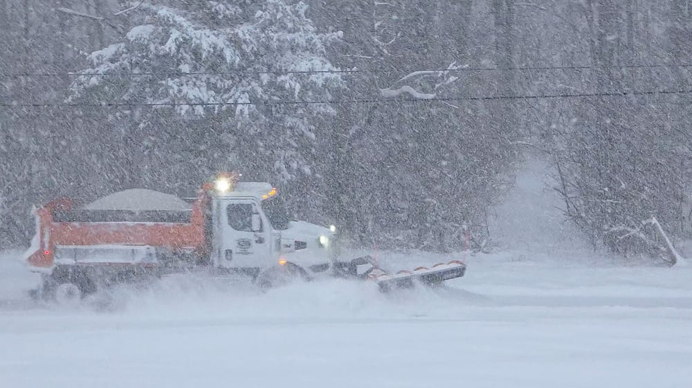 A Butler County Engineer's Office truck plows snow from Elk Creek Road Sunday morning, Jan. 25, 2026 in Madison Twp. By 10 a.m., the region had experienced nearly 12 inches of snow, with more on the way. Visit Journal-News.com for the latest snow coverage. NICK GRAHAM/STAFFNICK GRAHAM/STAFF
