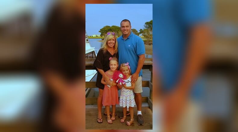 Tammy and Jason Snyder with their younger girls, Avery, 8, and Burke, 6. CONTRIBUTED