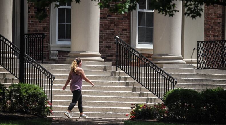 A woman exercises on the UD campus Monday July 13, 2020. Jim Noelker/Staff