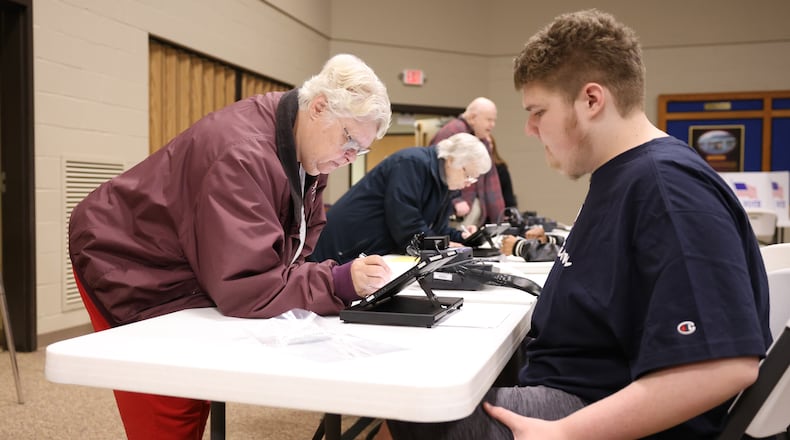 Voters sign in at a polling location at New Season Ministry on Tuesday, Nov. 4 in Huber Heights. Poll workers said at around 11 a.m. turnout was slightly lower than normal compared to similar cycles. Huber Heights voters did not have many contested races and decided on one issue, a renewal Montgomery County property tax. BRYANT BILLING/STAFF