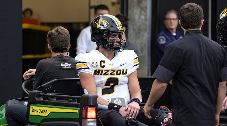 Missouri quarterback Beau Pribula is driven off the field after being injured during the second half of an NCAA college football game against Vanderbilt, Saturday, Oct. 25, 2025, in Nashville, Tenn. (AP Photo/Wade Payne)