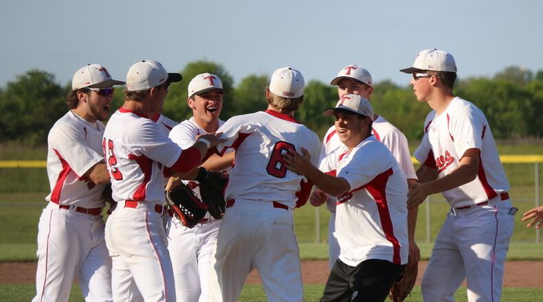 Tippecanoe’s baseball players mob then-junior Aaron Hughes (6) after his three-hit, complete-game shutout in a 1-0 defeat of Springfield Shawnee in the Division II sectional final last season. GREG BILLING/CONTRIBUTED