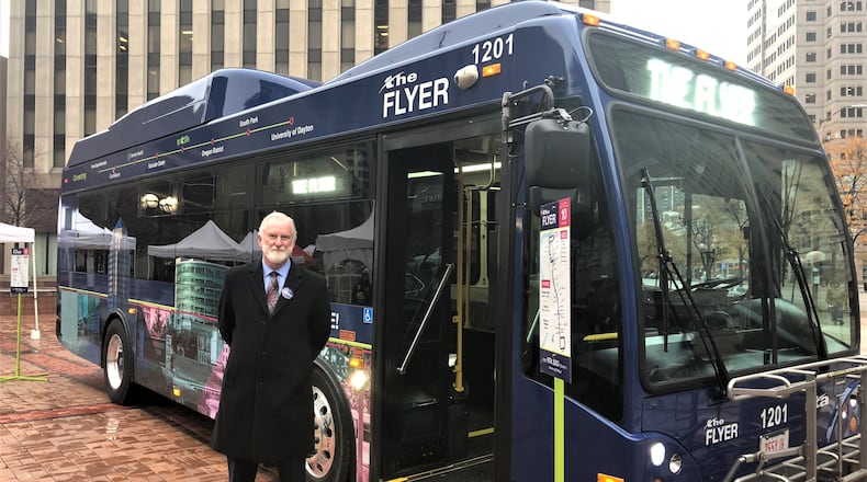 Mark Donaghy, Greater Dayton RTA CEO, stands next to the Flyer, a downtown shuttle bus free for riders. CORNELIUS FROLIK / STAFF