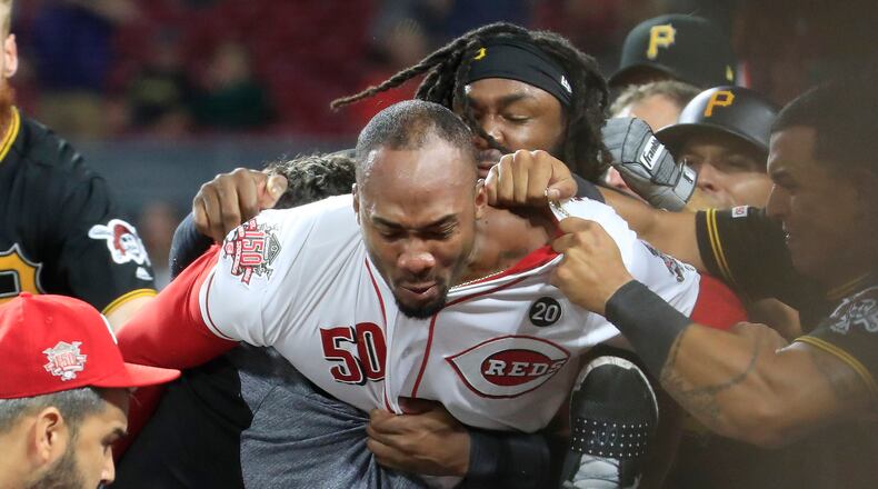 CINCINNATI, OHIO - JULY 30: Amir Garrett #50 (middle white shirt with out hat) of the Cincinnati Reds engages members of the Pittsburgh Pirates during a bench clearing altercation in the 9th inning of the game  at Great American Ball Park on July 30, 2019 in Cincinnati, Ohio. (Photo by Andy Lyons/Getty Images)
