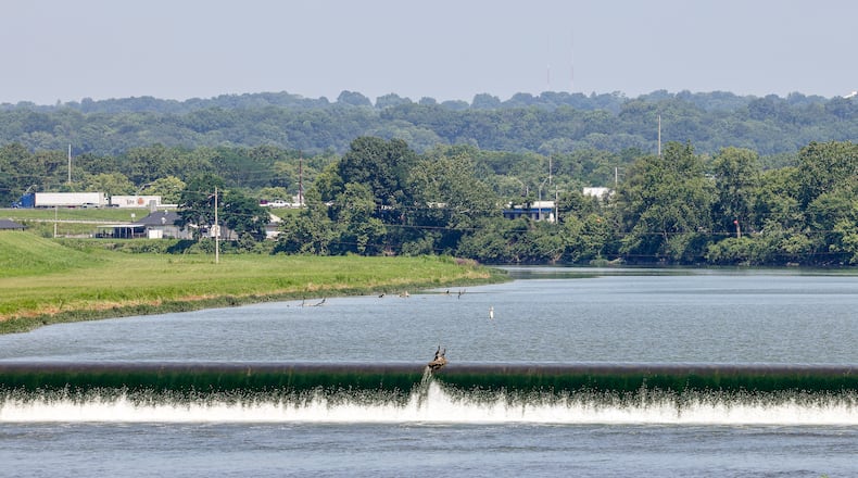 West Carrollton continues to advance plans to develop the area along East Dixie Drive just west of Interstate 75's Exit 47. One key feature of the development will be a whitewater park on the Great Miami River. BRYANT BILLING/STAFF