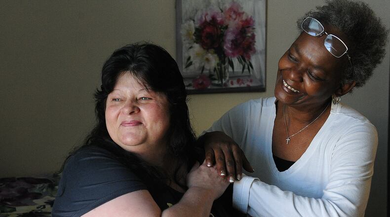 Dayton VA Tenant Sherry Roth, left, with her Case Manager, Donellin Sims. MARSHALL GORBY\STAFF