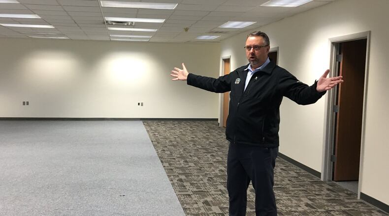Ohio University associate dean for industry partnerships Scott Miller stands inside of a building at the Russ Research Center in Beavercreek Twp. OU is considering renovating the building to include a conference center and classroom space.