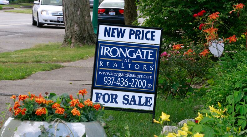 A house for sale along South Fountain Ave. in Springfield. The share of homes purchased by all-cash buyers dipped slightly last fall, indicating a healthier housing market, experts said. Bill Lackey/Staff