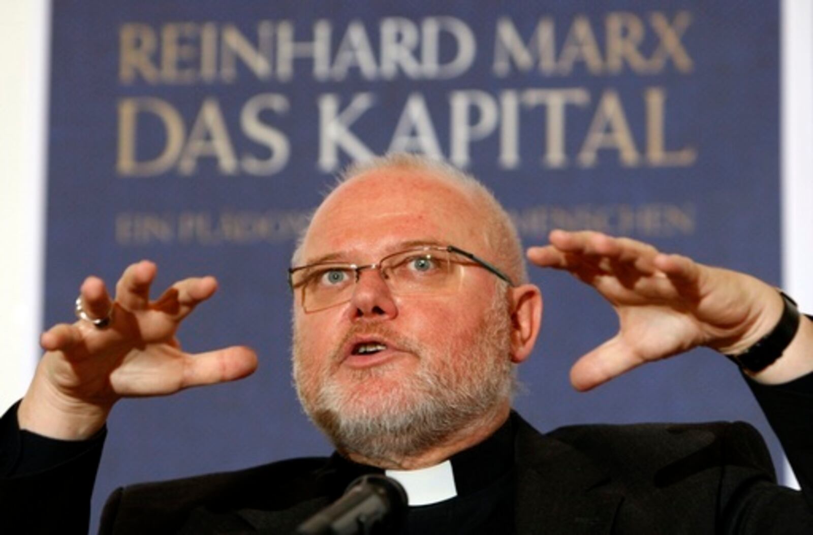 FILE - Munich and Freising Archbishop Reinhard Marx presents his new book 'The Capital' in Munich, southern Germany, Wednesday, Oct. 29, 2008. (AP Photo/Matthias Schrader)