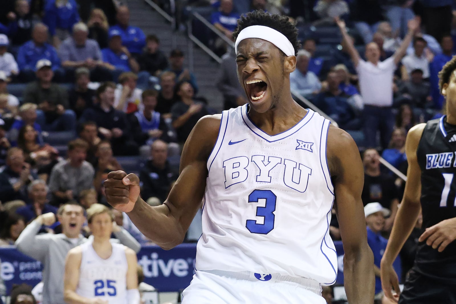 BYU forward AJ Dybantsa celebrates a dunk on Delaware during the second half of an NCAA college basketball game, Tuesday, Nov. 11, 2025, in Provo, Utah. (AP Photo/Jeffrey D. Allred)