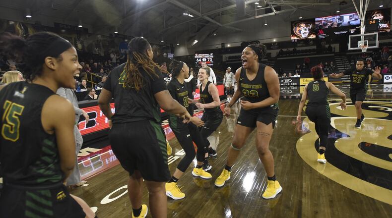 Members of Wright State’s women’s basketball team celebrate their win over Oakland on Saturday that clinched an outright Horizon League title. Jose Juarez/CONTRIBUTED