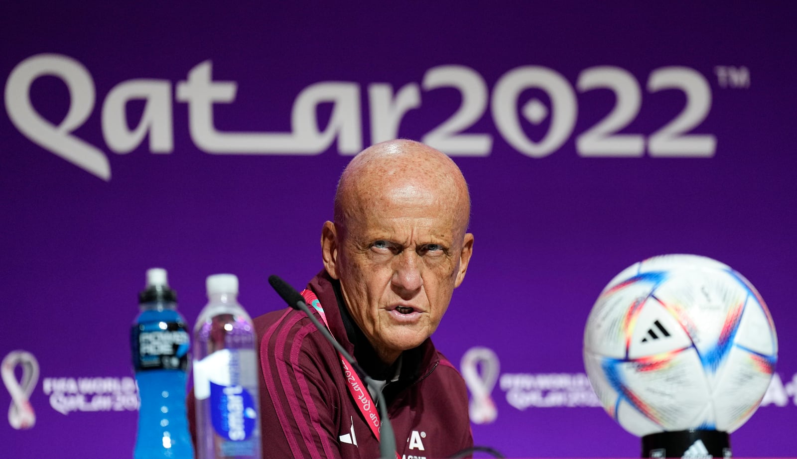 FILE - Chairman of the FIFA referees committee Pierluigi Collina reacts at a press conference of the FIFA referees at the World Cup media center in Doha, Qatar, Friday, Nov. 18, 2022.(AP Photo/Martin Meissner, file)