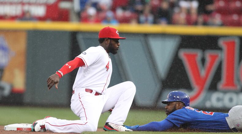 The Cubs’ Jason Heyward steals second just ahead of the tag by the Reds second baseman Brandon Phillips on Friday, April 22, 2016, at Great American Ball Park in Cincinnati. David Jablonski/Staff»