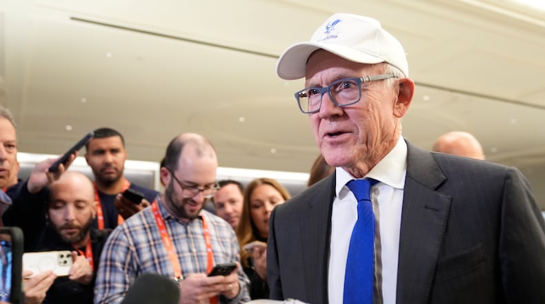 New York Jets owner Woody Johnson talks to reporters before attending an NFL owners meeting in New York, Tuesday, Oct. 21, 2025. (AP Photo/Seth Wenig)