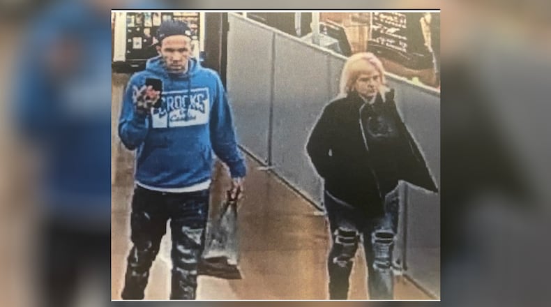 Dayton police are looking for two people suspected of using a stolen credit card at area businesses. Photo courtesy Dayton Police Department.