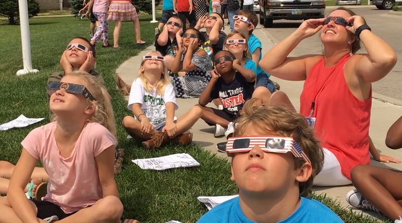 Horace Mann Elementary School students and teachers watch the solar eclipse at the Springfield school. Bill Lackey/Staff
