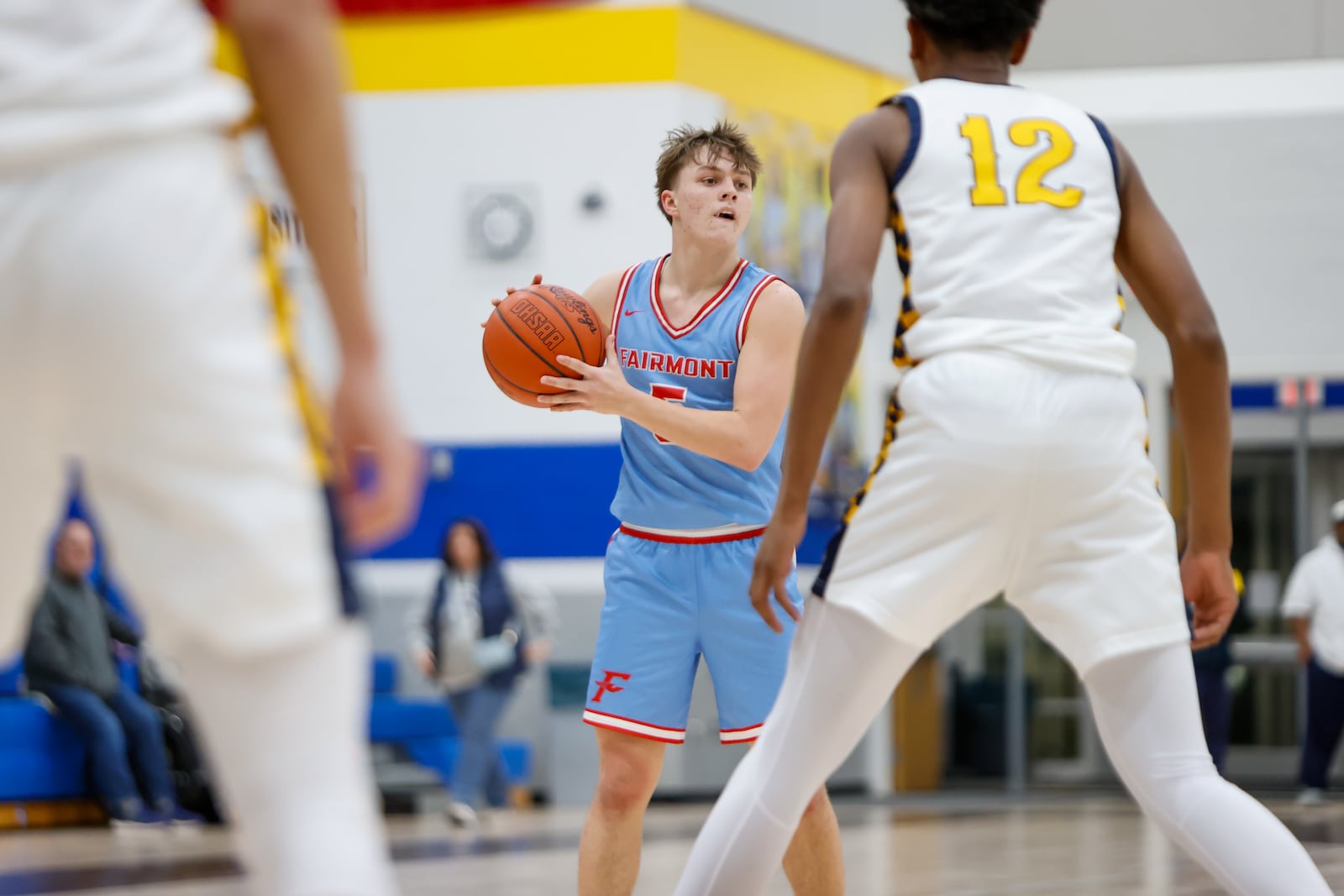 Fairmont High School senior Kaden Ralston looks for an open man during their game on Tuesday, Jan. 6 at Springfield High School. The Firebirds won 54-46. MICHAEL COOPER / STAFF PHOTO