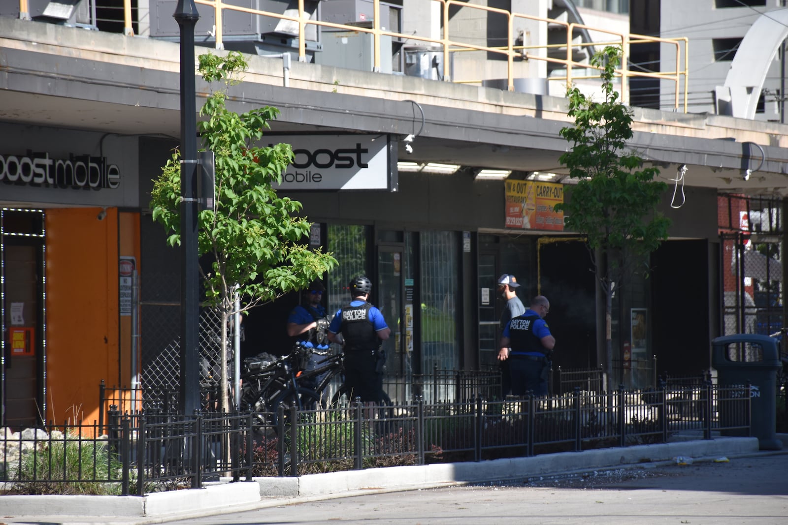 Dayton police officers on South Jefferson St. near the downtown Greater Dayton RTA bus hub. CORNELIUS FROLIK / STAFF