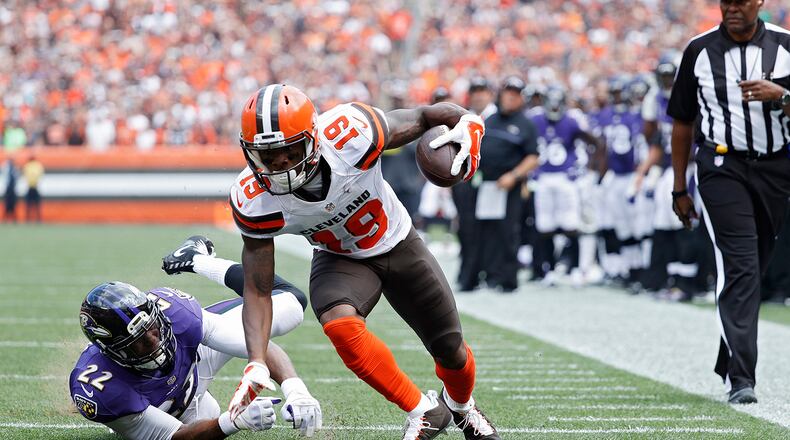 CLEVELAND, OH - SEPTEMBER 18: Corey Coleman #19 of the Cleveland Browns breaks a tackle on his way to an 11-yard touchdown reception against Jimmy Smith #22 of the Baltimore Ravens in the first quarter at Cleveland Browns Stadium on September 18, 2016 in Cleveland, Ohio. (Photo by Joe Robbins/Getty Images)