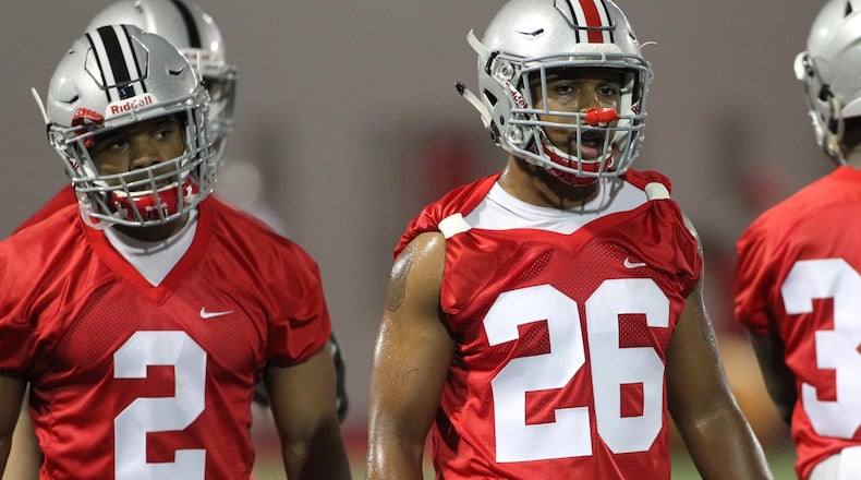 Ohio State's J.K. Dobbins (2) and Antonio Williams (26) practice on Tuesday, March 6, 2017, at the Woody Hayes Athletic Center in Columbus. David Jablonski/Staff