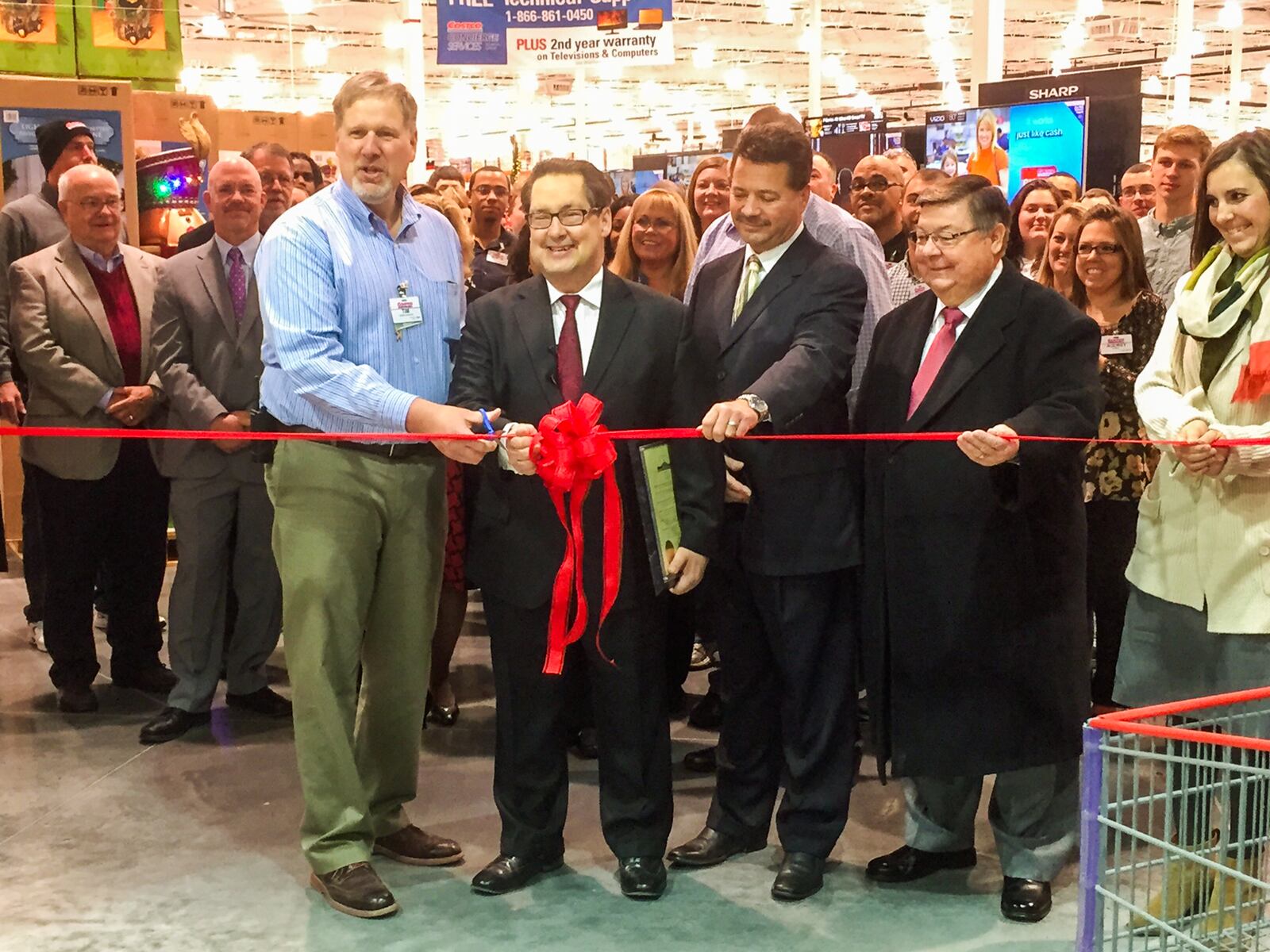 Centerville Mayor Mark Kingseed, second from left, participated in a ribbon cutting in November 2014 when a new Costco store opened at the Cornerstone development.