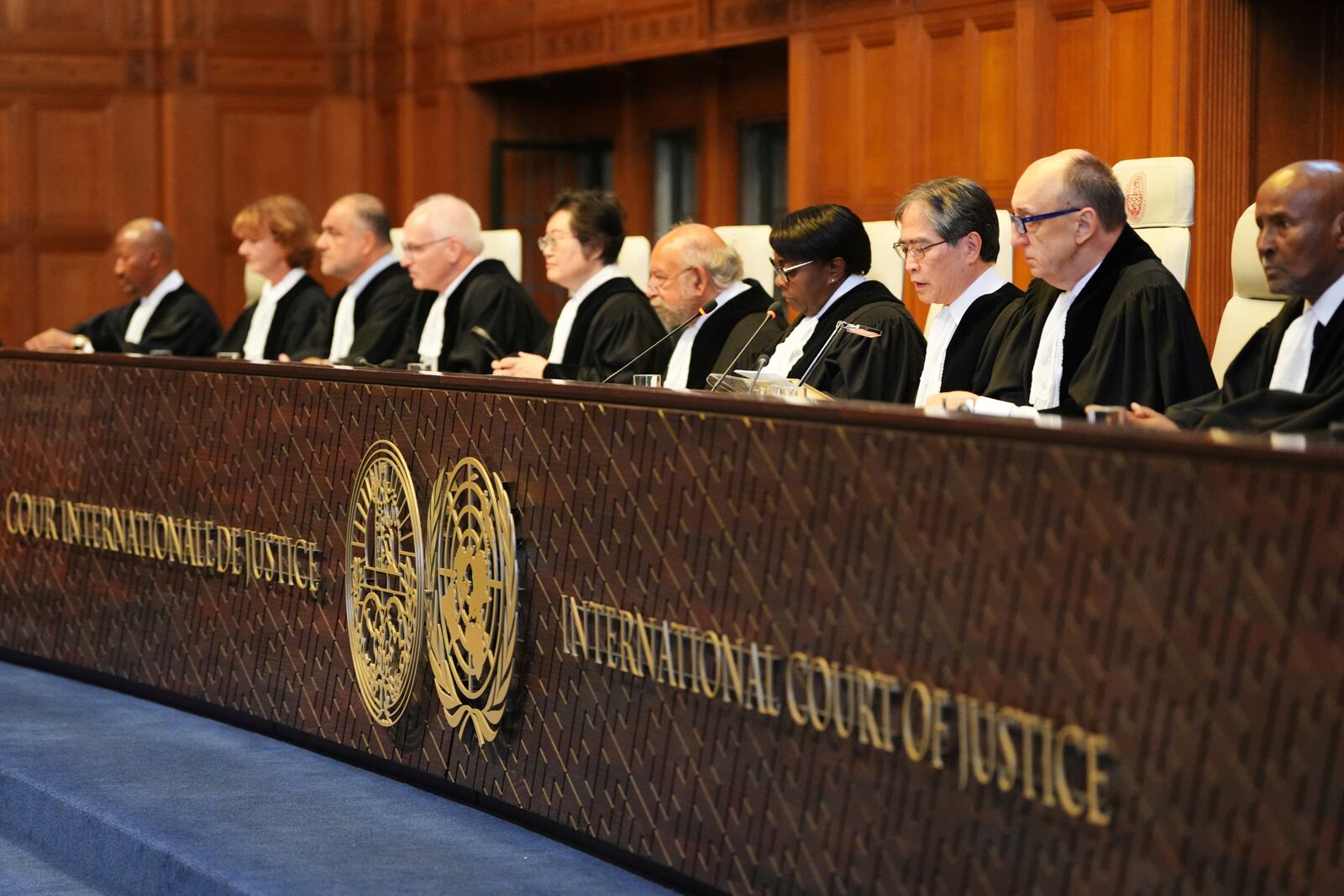 Presiding judge Yuji Iwasawa, third from right, speaks at the International Court of Justice ahead of an advisory opinion on what legal obligations nations have to address climate change and what consequences they may face if they don't, Wednesday, July 23, 2025, in The Hague, Netherlands. (AP Photo/Peter Dejong)
