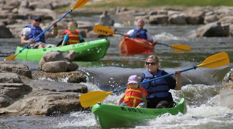An image from a video displayed during a press conference at West Carrollton Civic Center in 2023, shows people enjoying a whitewater attraction in Michigan. West Carrollton will receive more than $1.2 million in state funding to advance a planned whitewater park along the Great Miami River. CONTRIBUTED
