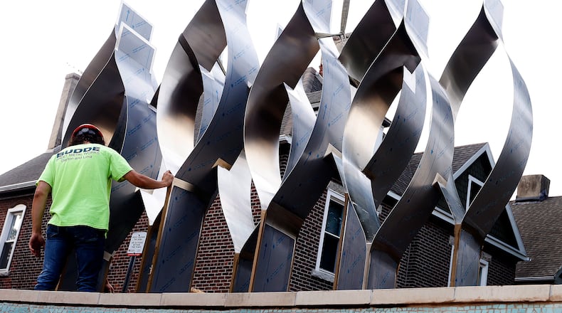 The Seed of Life sculpture for the Oregon District shooting memorial was craned in Thursday, July 25, 2024. MARSHALL GORBY\STAFF