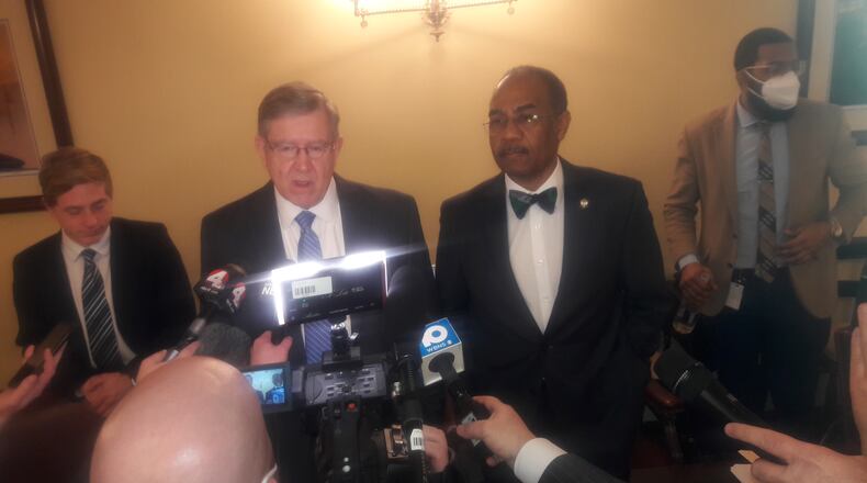 House Speaker Bob Cupp, R-Lima (center left) and state Sen. Vernon Sykes, D-Akron (center right) talk to reporters after the Ohio Redistricting Commission meeting Feb. 22, 2022.