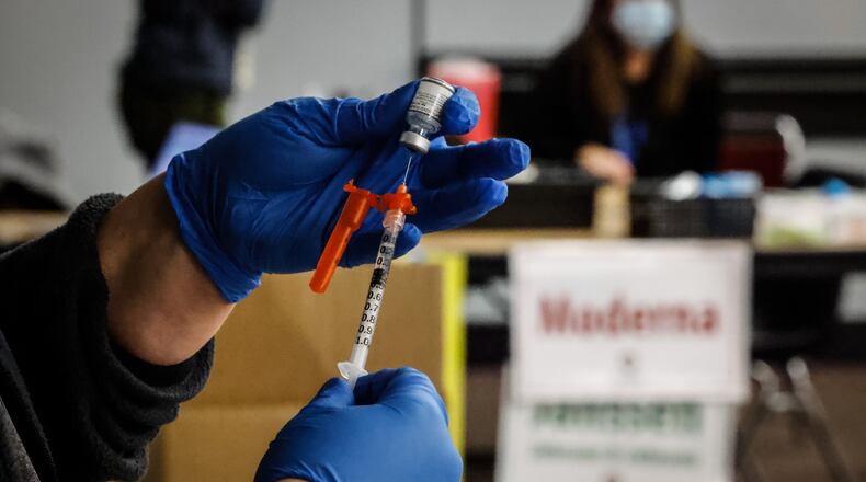 Public Health - Dayton & Montgomery County is recommending individuals stay up to date on their vaccinations, as well as monitor any COVID-19 symptoms and isolate yourself if you are sick. JIM NOELKER/STAFF