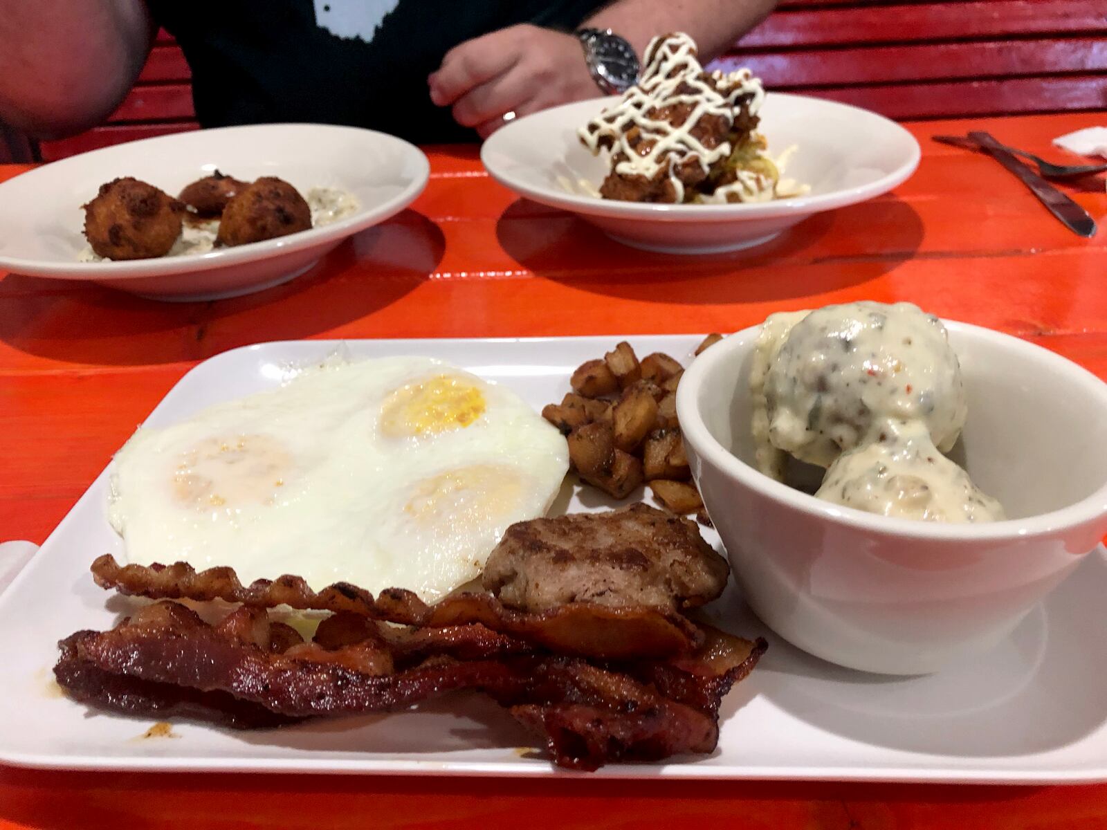 Stoney's Munchie Bat is open at 1829 E. Fifth St. in Dayton.   A classic breakfast with Limp Bizkits is pictured in the forefront. A half order of chicken and waffles and Limp Bizkits and Gravy is pictured in the back.