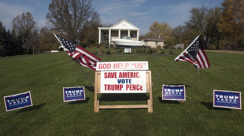 Campaign signs, supporting Donald Trump and Mike Pence, are displayed on November 8, 2016 in Salem, Ohio. This year, roughly 200 million Americans have registered to vote in this years general election. (Photo by Ty Wright/Getty Images)
