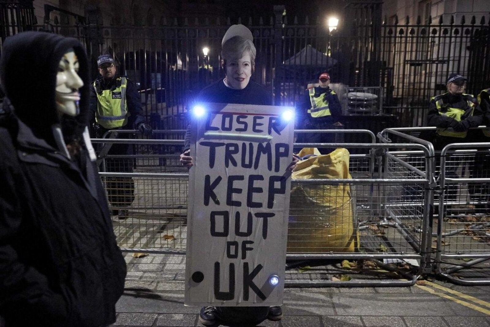 A protester holds a placard against President Trump's visit to the U.K. in London on Nov. 5, 2017.