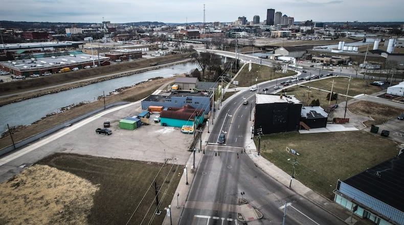 The city of Dayton is hoping to find a partner to develop a one-acre site at the northeast corner of Keowee and Valley streets into new housing. The site is near the Mad River and the new housing could have sweeping views of the river corridor and downtown. JIM NOELKER/STAFF