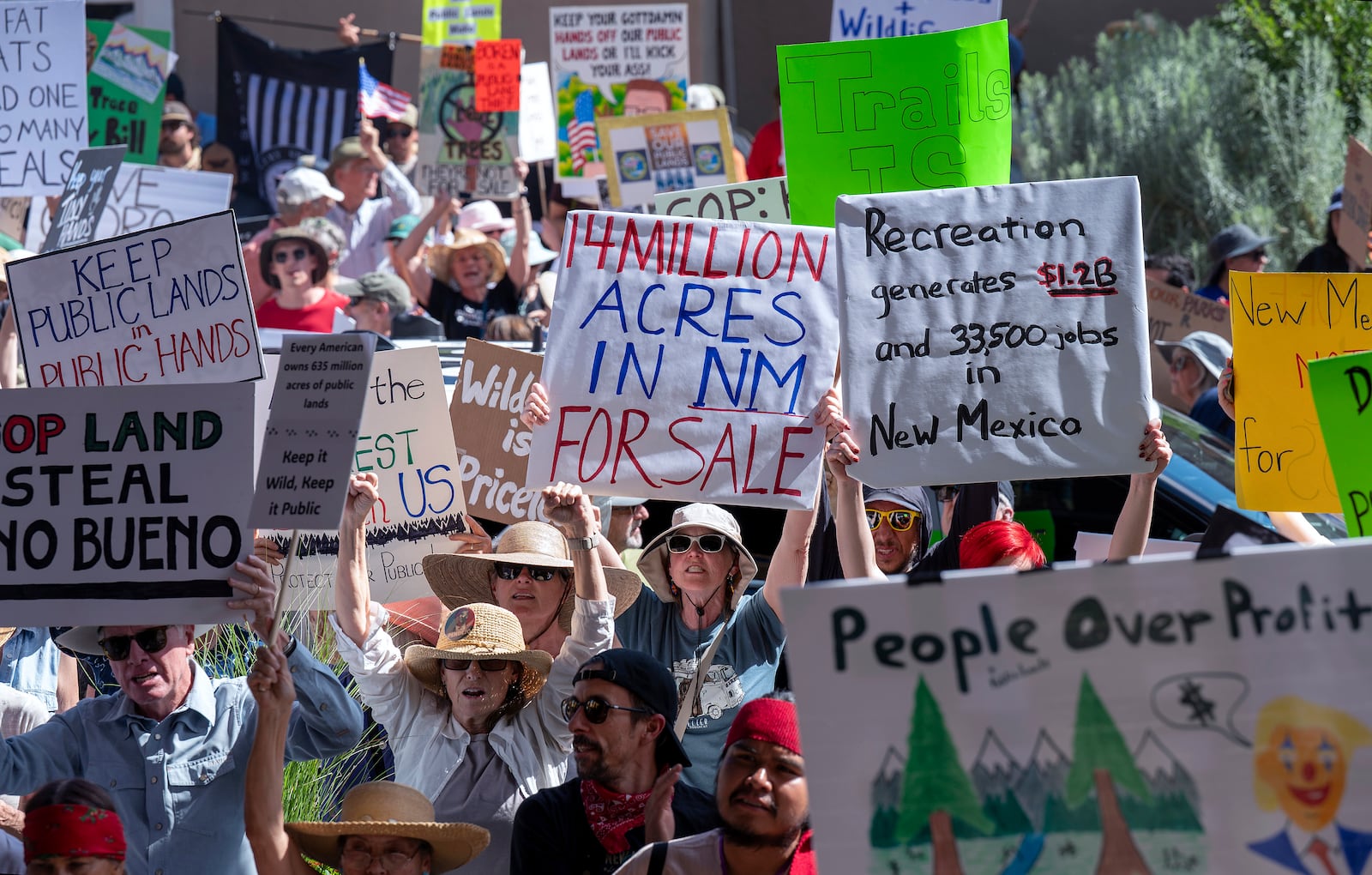 A few thousand people rally outside the Eldorado Hotel to protest against the sale of public lands by the Trump administration, during the Western Governors Association meeting in Santa Fe, N.M., Monday, June 23, 2025. (Eddie Moore/The Albuquerque Journal via AP)