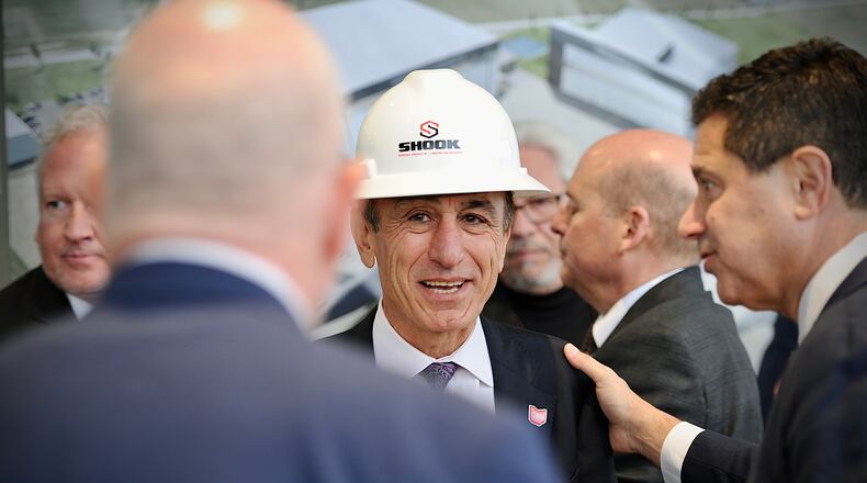 Fatih Ozmen, CEO of Sierra Nevada Corp, talks with people Wednesday February 2, 2022 just before the Groundbreaking ceremony of the Sierra Nevada’s new aviation modification facility at Dayton international airport. MARSHALL GORBY \STAFF