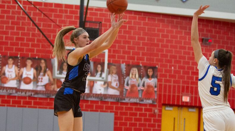 Springboro freshman Ava Wade shoots from 3-point range over Miamisburg's Dara Russo at Troy High School Monday night in a Division I district semifinal. Wade made three 3-pointers and scored 13 points in the first half to lead the Panthers to a 42-19 halftime lead. Jeff Gilbert/CONTRIBUTED