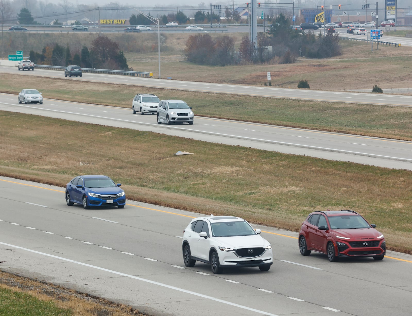 Vehicles travel on Interstate 675 below the Wright State Way pedestrian bridge on Thursday, Nov. 20, 2025, in Fairborn. Approximately 81.8 million people are projected to travel 50 miles or more from home over the Thanksgiving holiday period, according to AAA. JOSEPH COOKE/STAFF