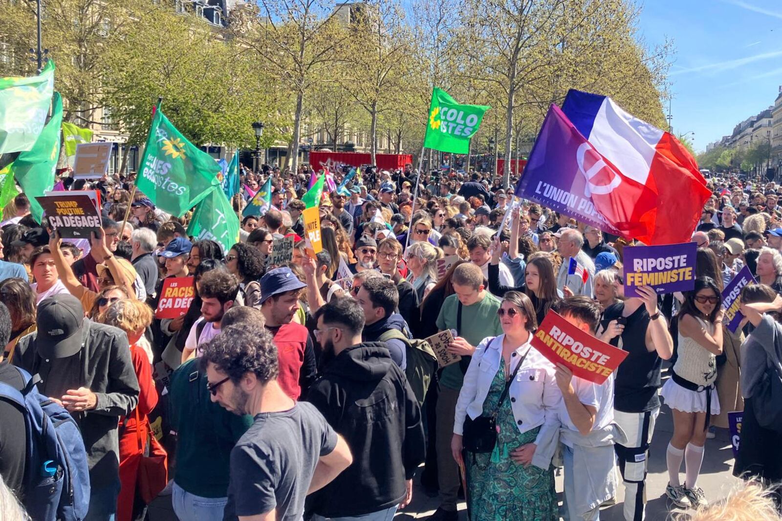 People gather during a leftist demonstration at Place de la République, denouncing what organizers called a "Trumpist turn" by Le Pen's National Rally (RN) party, while supporters of French far-right leader Marine Le Pen were gathering to protest her conviction for embezzlement and a five-year ban on running for office, Sunday, April 6, 2025 in Paris. (AP Photo/Jeffrey Schaeffer)