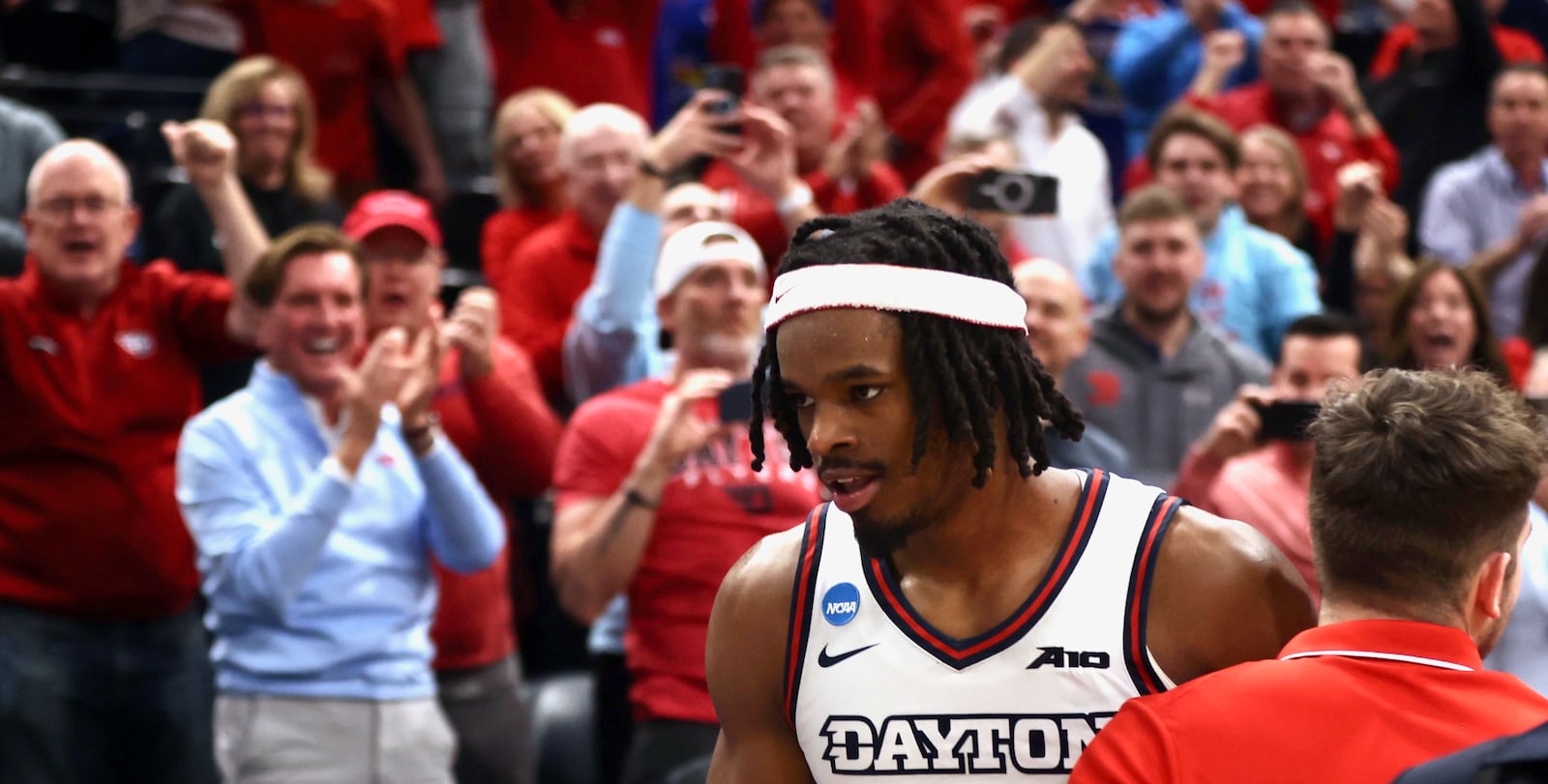 Dayton's DaRon Holmes II heads to the postgame handshake line after a victory against Nevada in the first round of the NCAA tournament on Thursday, March 21, 2024, at the Delta Center in Salt Lake City, Utah. David Jablonski/Staff